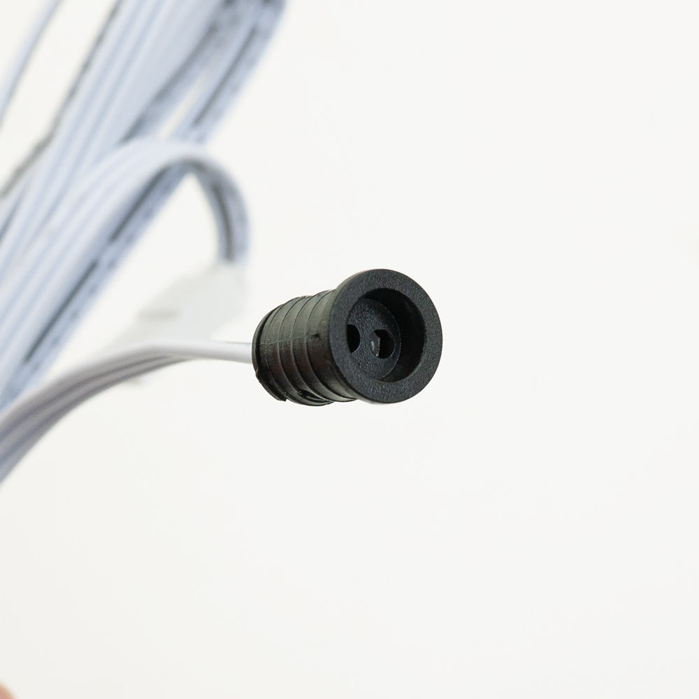 Close-up of a black connector end of a wire, designed for electrical applications and connections.