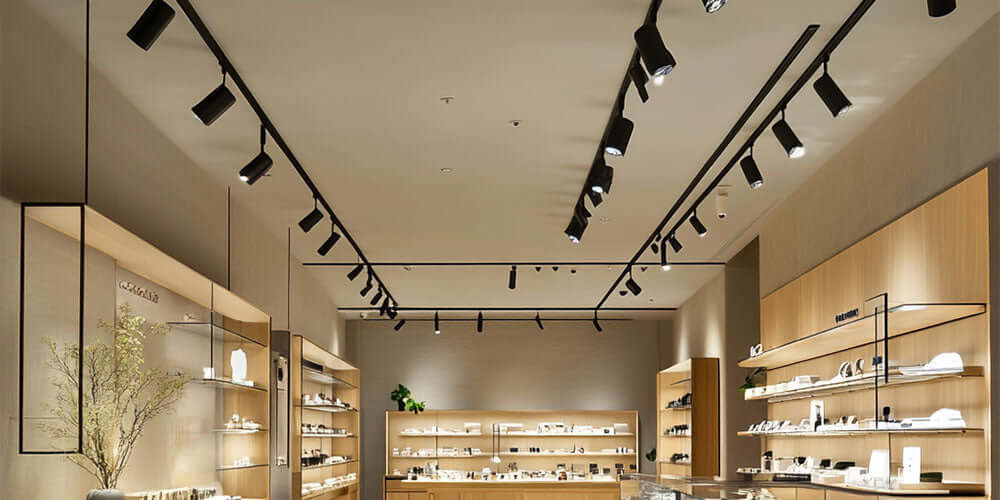 Modern track lighting showcasing a retail space with stylish display shelves and ambient illumination.