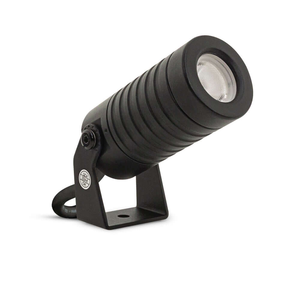 Outdoor LED landscape spotlight in black, 24V, 2.6W, producing warm white light at 3000K, ideal for gardens.