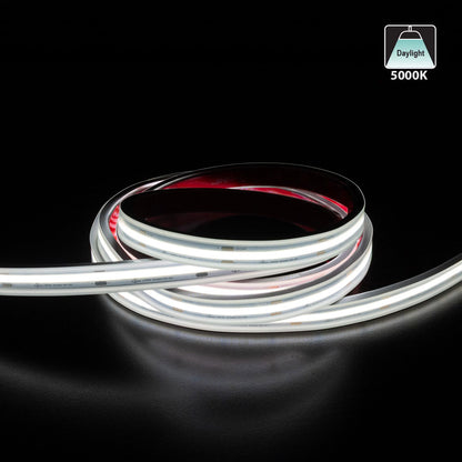Custom cut outdoor COB LED strip light showcasing flexible daylight 5000K illumination on a black surface.