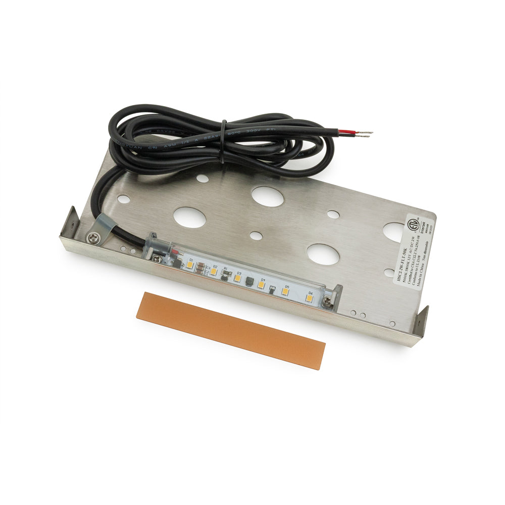 Stainless steel base with LED light strip and wiring for outdoor landscape lighting installation.