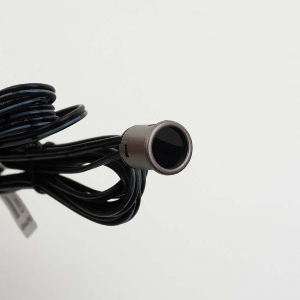 Close-up of a brown single head door sensor switch LP-5028 mini with black wiring, designed for 12-24V systems.