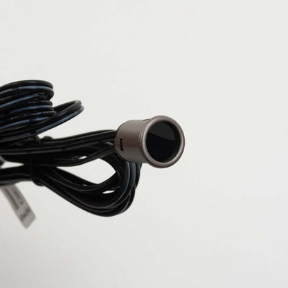 Close-up of a brown single head door sensor switch LP-5028 mini with black wiring, designed for 12-24V systems.