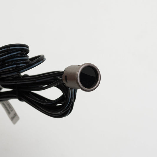 Close-up of a brown single head door sensor switch LP-5028 mini with black wiring, designed for 12-24V systems.